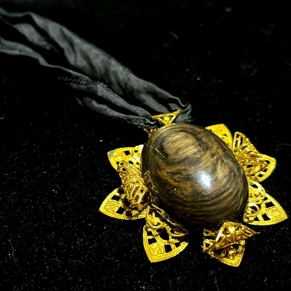 Chunky Hypersthene Amulet golden filigree wrapped set on a black silk cord